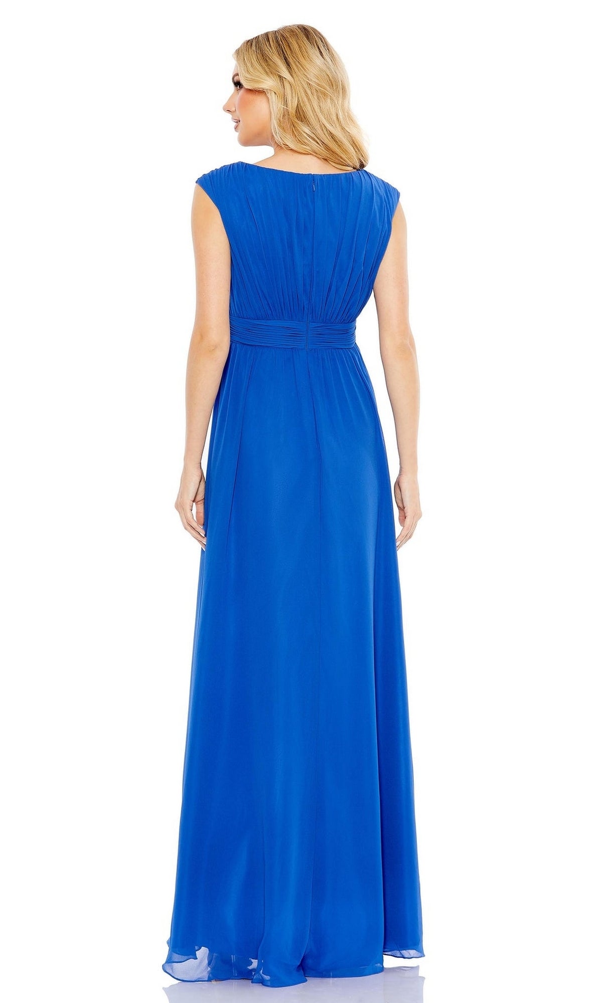 A woman with blonde hair is seen from the back wearing the Long Formal Dress 55863 by Mac Duggal, a sleeveless, floor-length cobalt blue gown featuring a ruched bodice and cinched waist.